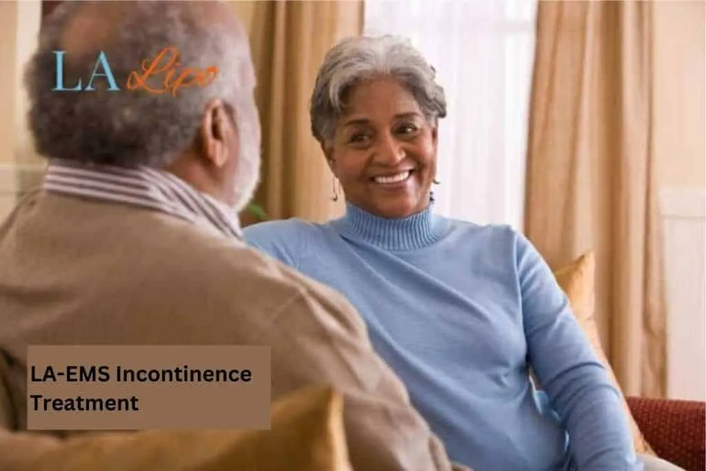 Couple sat smiling at each other - LA-EMS treatment Shropshire